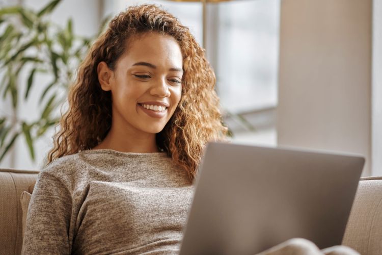 Woman reading on laptop